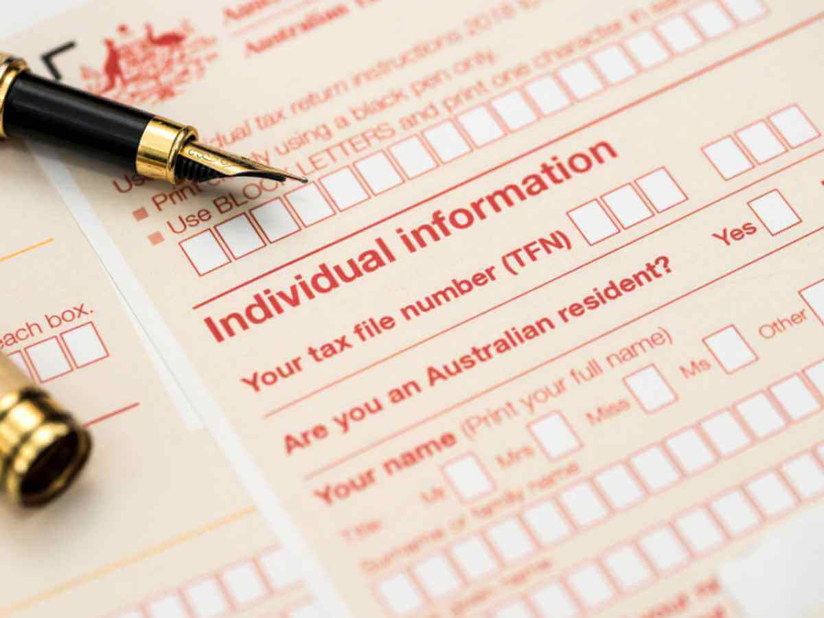 Close up image of an Australian annual income tax return form with a pen.