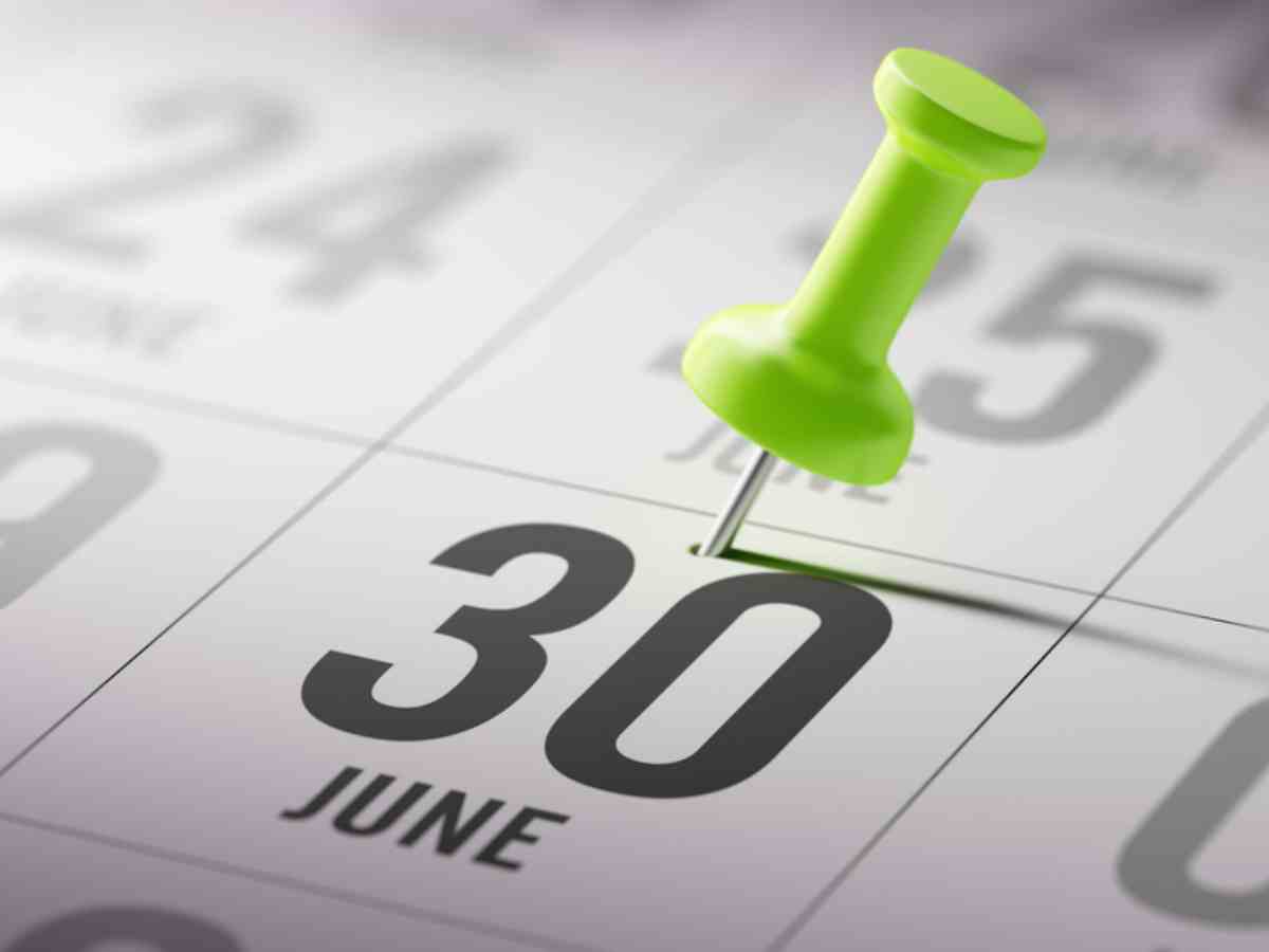 A close up of a calendar showing the 30 June date marked with a green thumb tack.