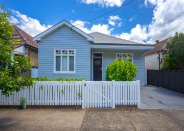 Inheriting property | a modest blue timber suburban home with a white picket fence