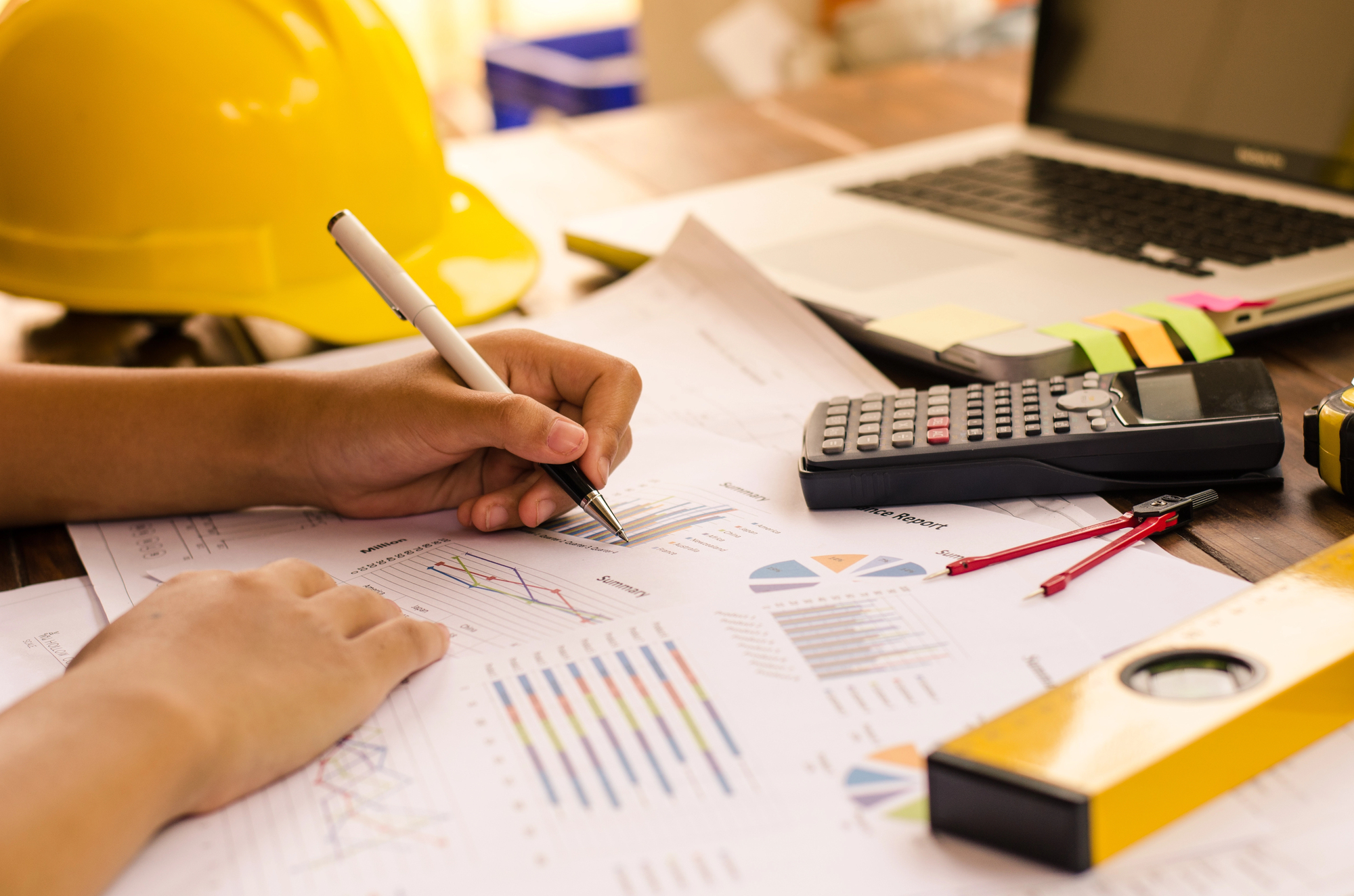 Builder-Construction-worker-working-on-accounts-and-finance-reports